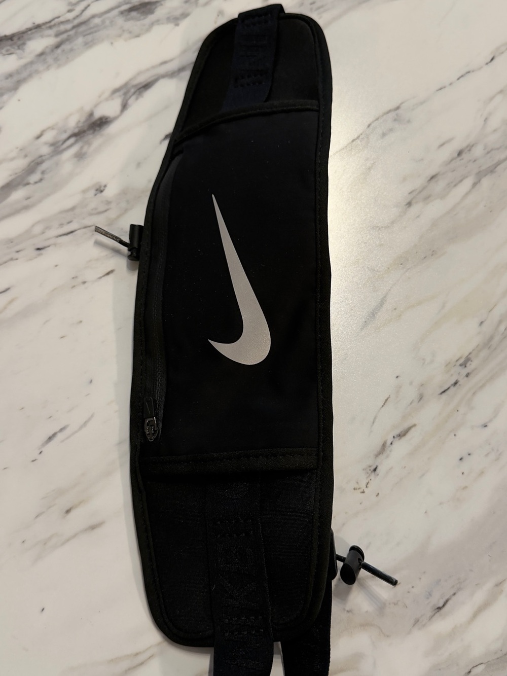 Nike Challenger 2.0 waist pack in black with a reflective logo